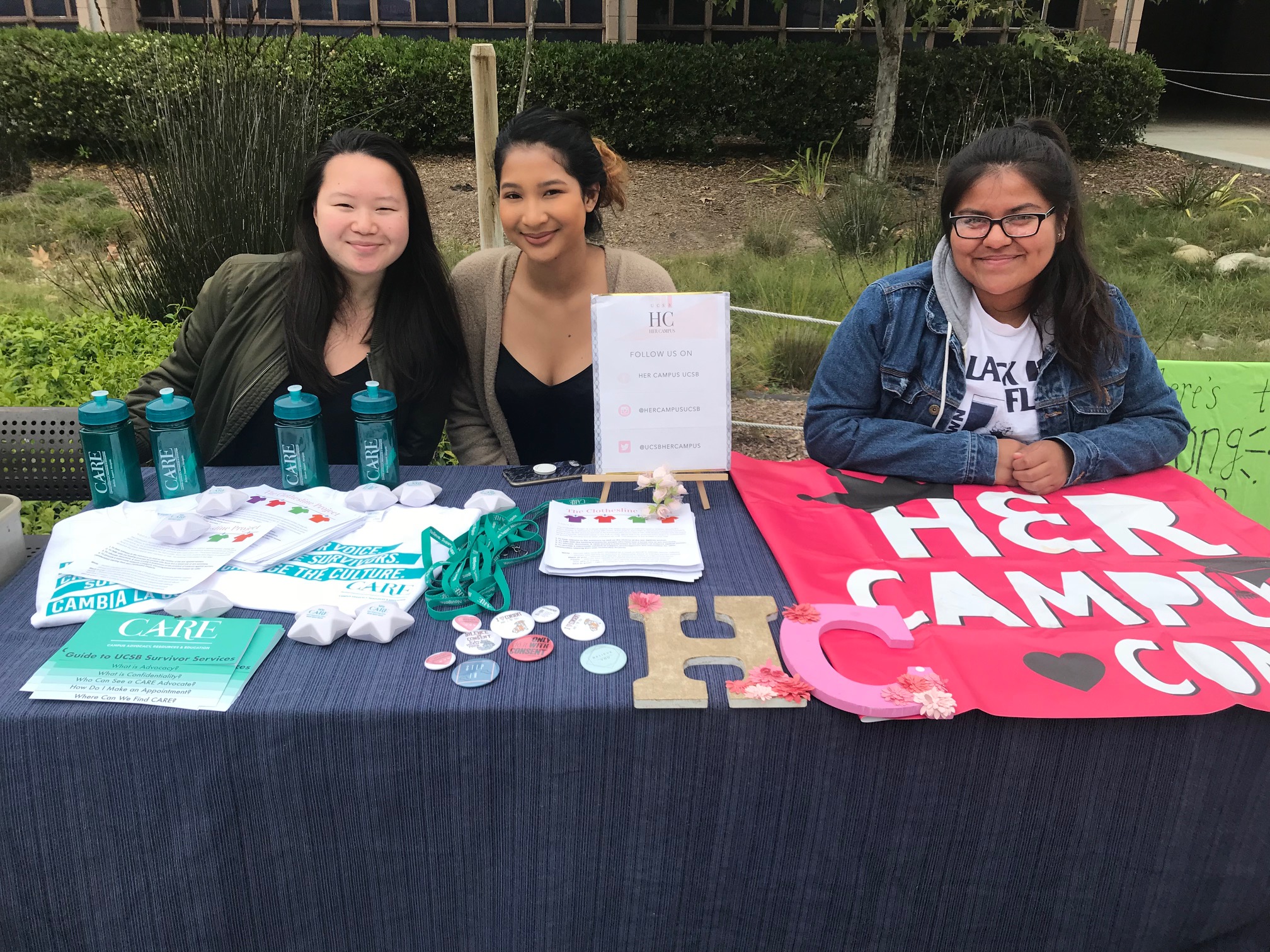 CARE Peer Educators tabling with HerCampus