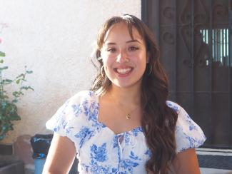 Stephanie Raya in a blue and white floral dress